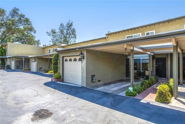 view of side of property with a garage