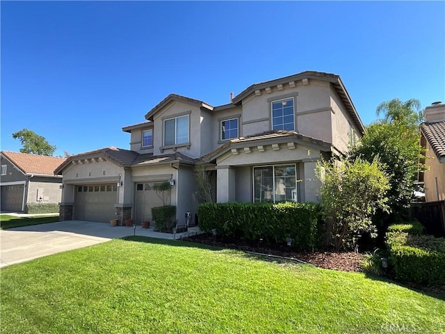 view of front of property with a front lawn and a garage