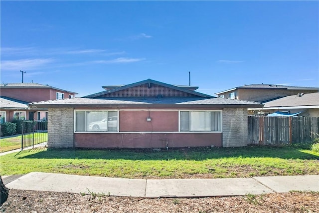 view of side of home featuring a lawn