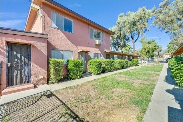 view of side of home featuring a yard