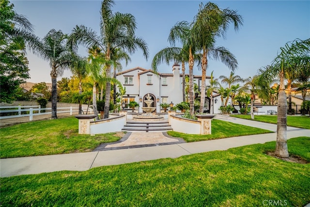 view of home's community featuring a lawn