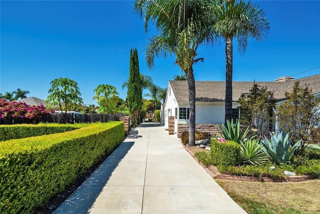 view of property's community with a lawn