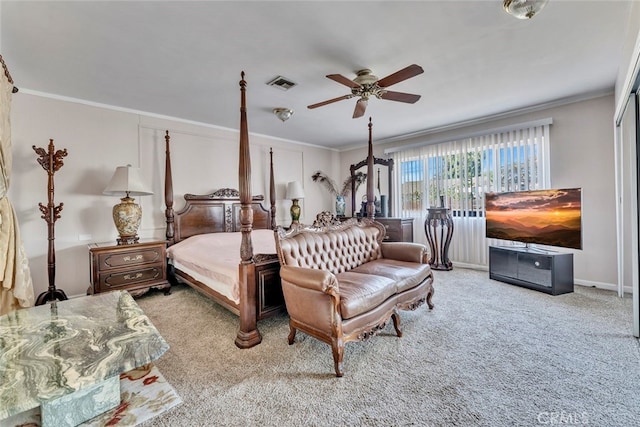 bedroom featuring ceiling fan, light carpet, and ornamental molding