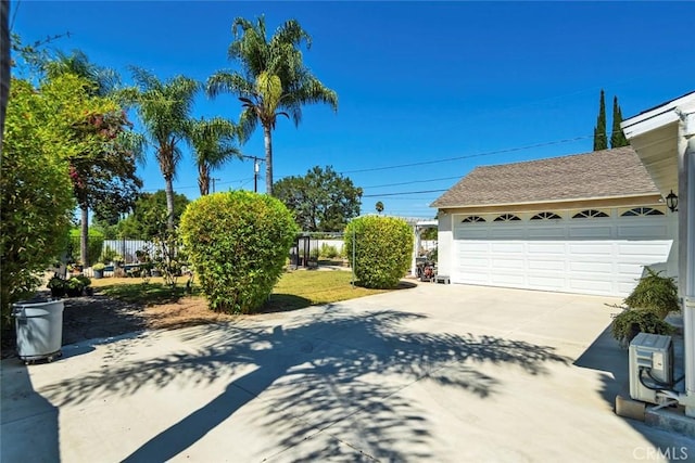 1021 S Lark Ellen Ave, West Covina, CA 91791 - exterior space featuring roof with shingles, a garage, and fence