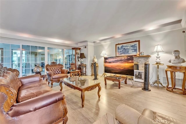 1021 S Lark Ellen Ave, West Covina, CA 91791 - living room with a glass covered fireplace, visible vents, and wood finished floors
