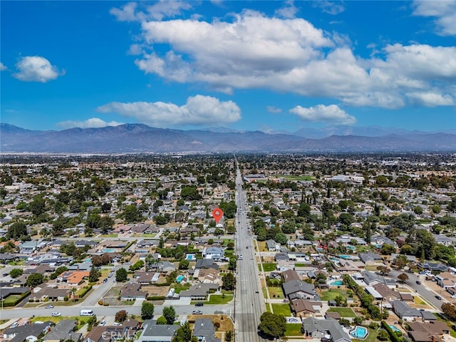 birds eye view of property with a mountain view