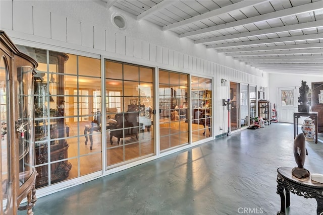 gym with concrete flooring and vaulted ceiling