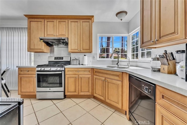 1021 S Lark Ellen Ave, West Covina, CA 91791 - kitchen with stainless steel range with gas stovetop, dishwasher, a sink, light countertops, and under cabinet range hood