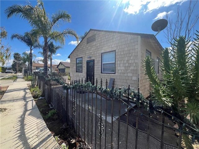 view of side of home featuring fence private yard