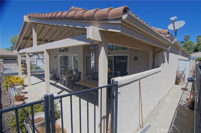 rear view of property with a patio area