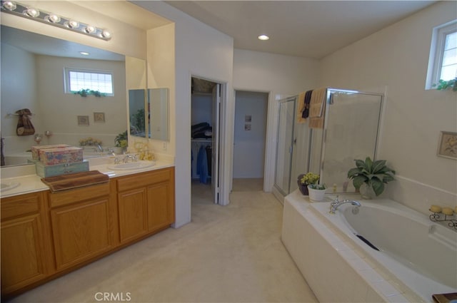 bathroom with vanity and plus walk in shower