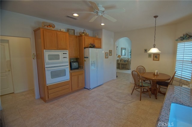 kitchen with white appliances, light tile patterned floors, pendant lighting, ceiling fan, and sink