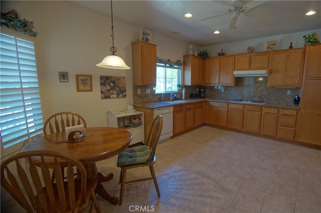 kitchen with backsplash, stainless steel gas cooktop, white dishwasher, decorative light fixtures, and sink