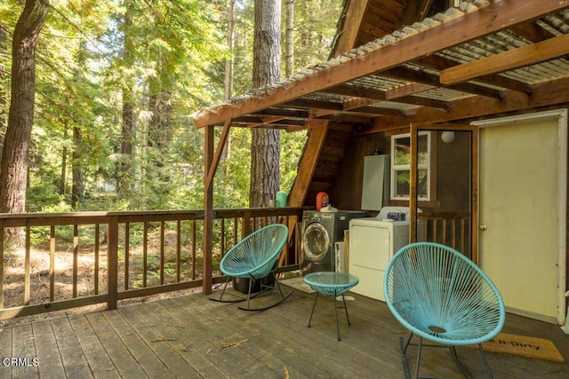 deck featuring independent washer and dryer