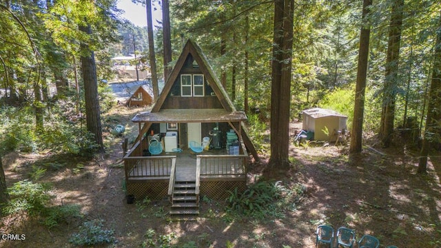 back of property with a wooden deck