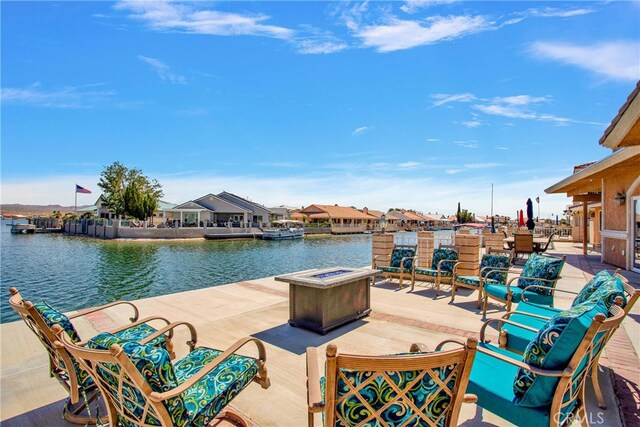 view of patio featuring an outdoor hangout area and a water view