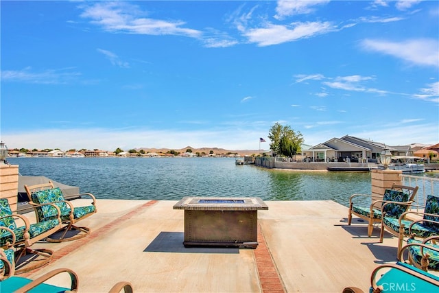 view of patio with a water view