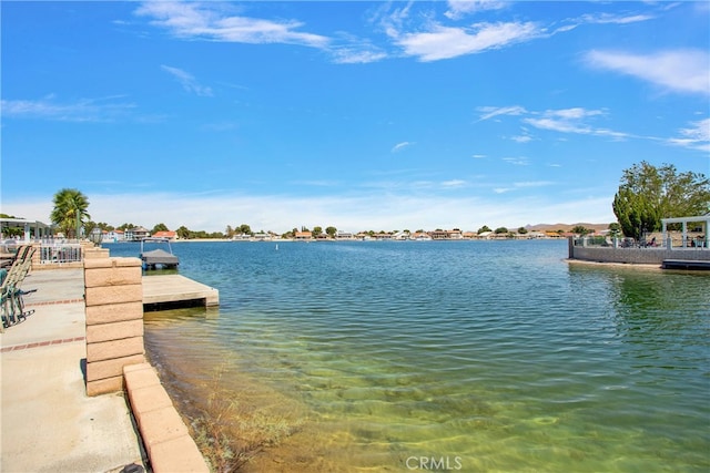 view of water feature with a dock