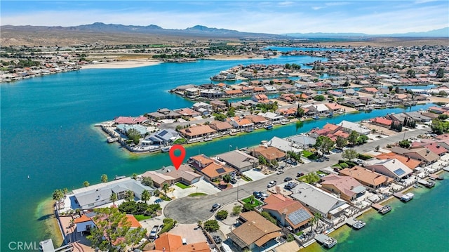 aerial view with a residential view and a water and mountain view