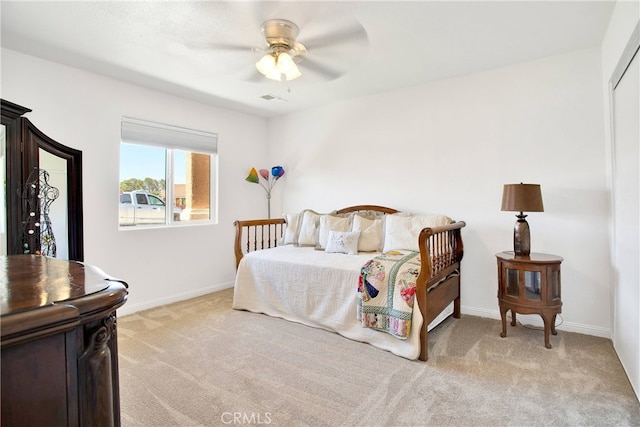 bedroom featuring ceiling fan and light colored carpet