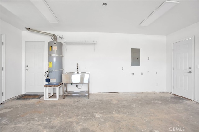 garage with secured water heater, electric panel, and a sink