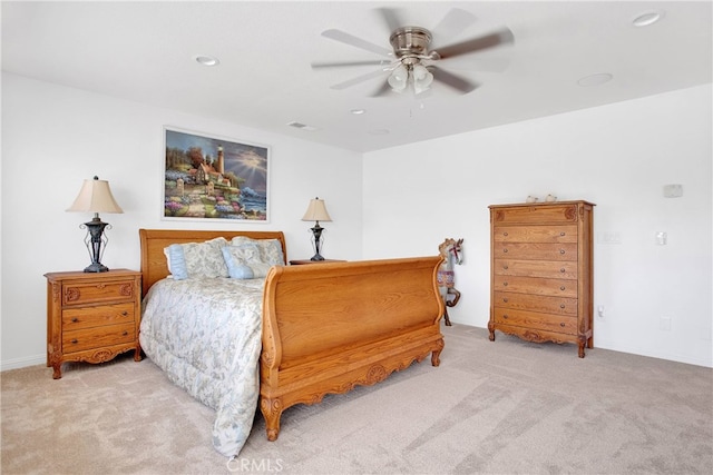 bedroom featuring ceiling fan and light carpet