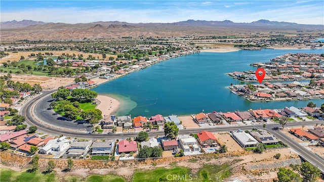 birds eye view of property featuring a water and mountain view