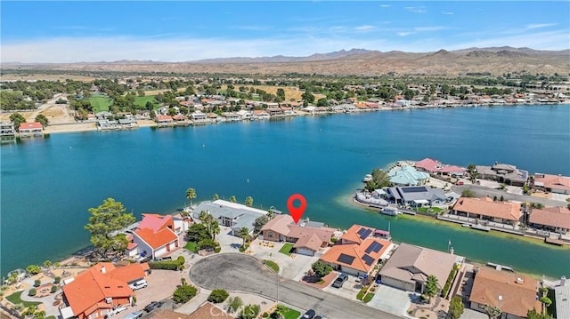 bird's eye view featuring a residential view and a water and mountain view