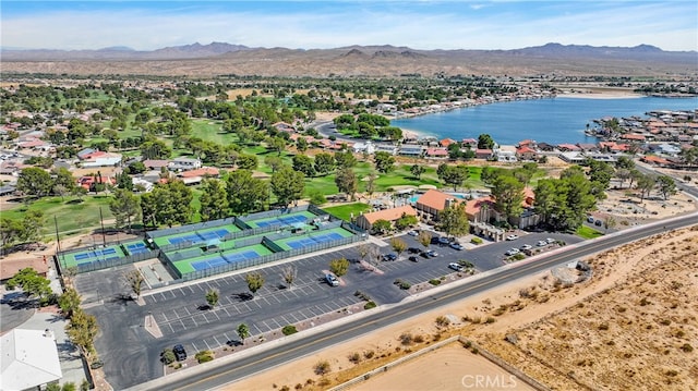 birds eye view of property featuring a water and mountain view