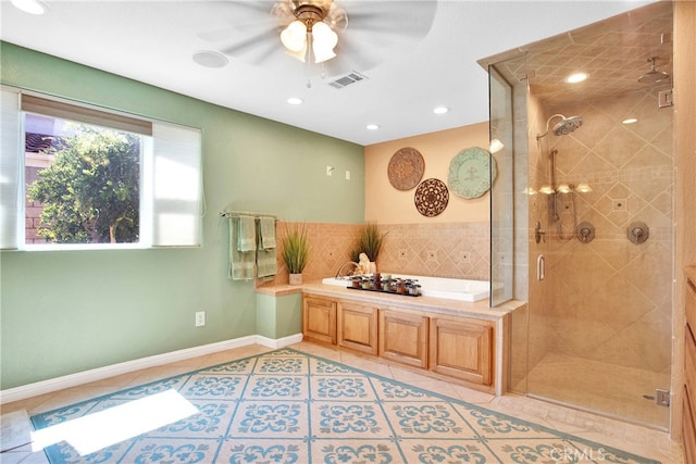 bathroom featuring ceiling fan, tile patterned floors, and separate shower and tub