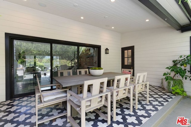 dining area with wood walls