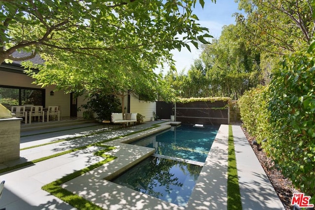 view of pool featuring a patio area