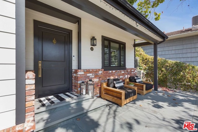 doorway to property with a porch