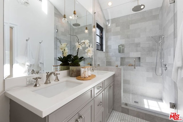 bathroom with vanity, tile patterned flooring, and a shower with door