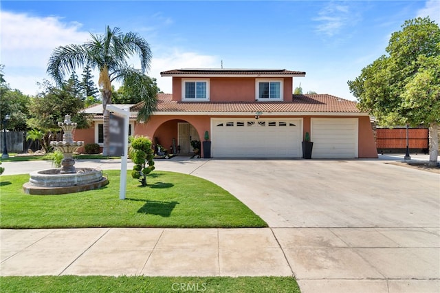 view of front of property featuring a garage and a front lawn