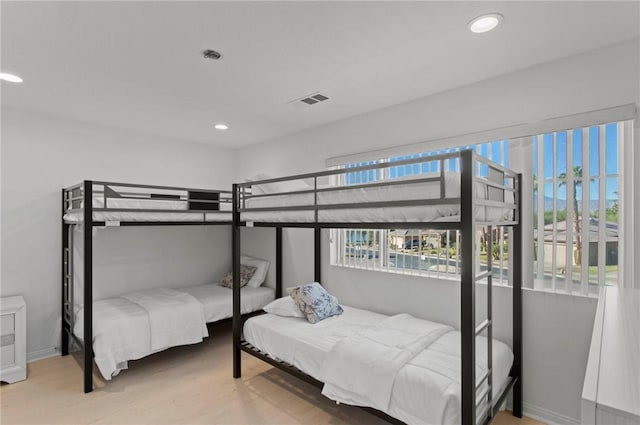 bedroom with wood-type flooring