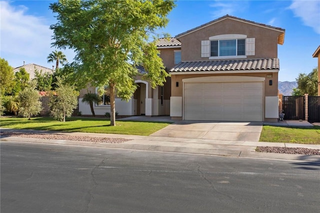 view of front of home featuring a front lawn and a garage