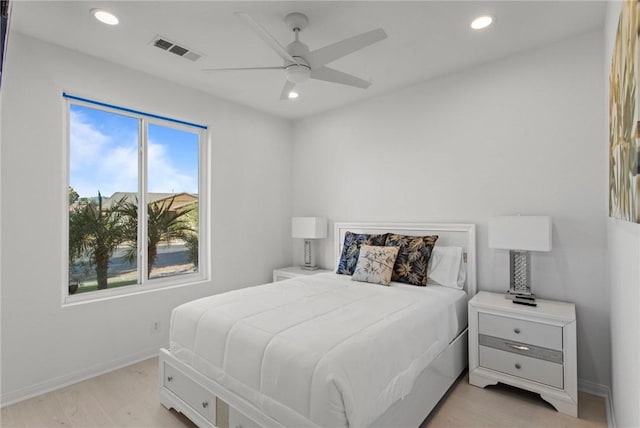 bedroom with ceiling fan and light wood-type flooring