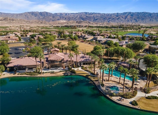 aerial view featuring a water and mountain view