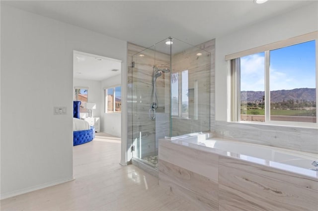 bathroom with a mountain view and shower with separate bathtub