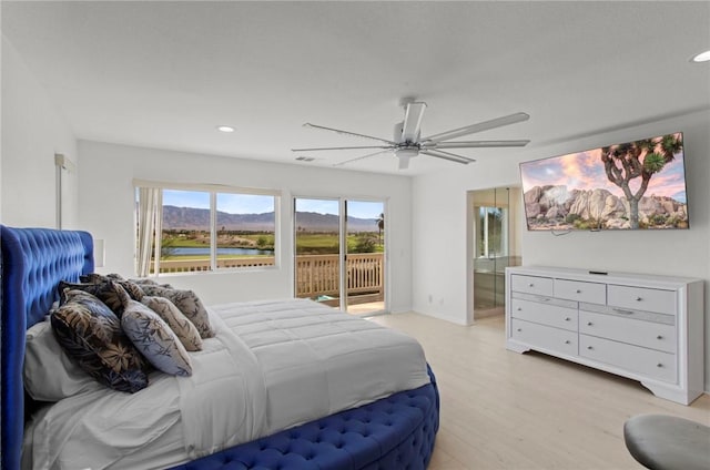 bedroom featuring access to exterior, ceiling fan, and light wood-type flooring