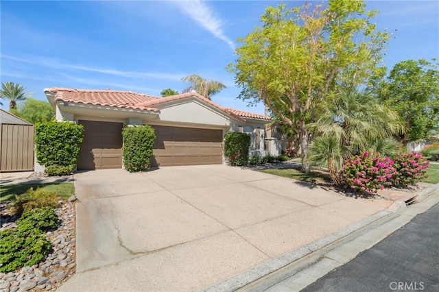 mediterranean / spanish-style home featuring a garage