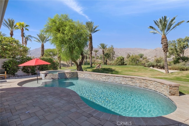 view of swimming pool with a mountain view, a yard, an in ground hot tub, and a patio area