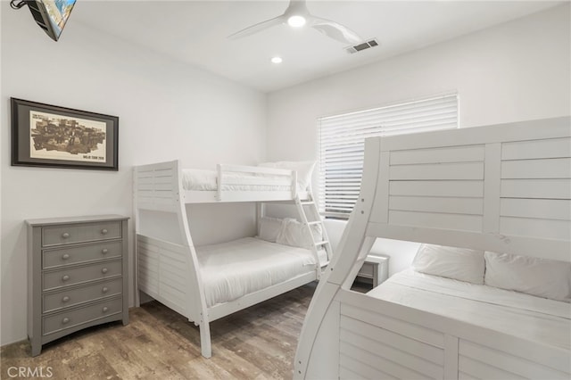 bedroom with ceiling fan and dark hardwood / wood-style floors