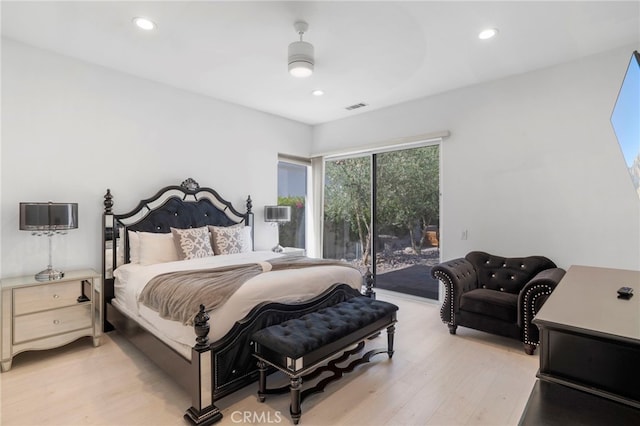 bedroom featuring access to exterior, ceiling fan, and light hardwood / wood-style flooring