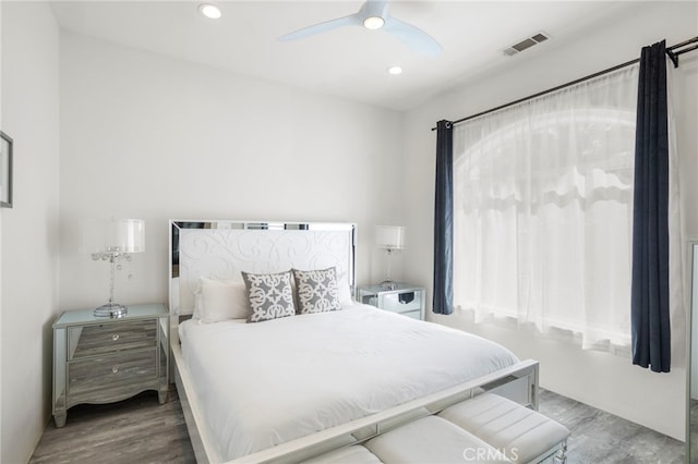 bedroom with hardwood / wood-style flooring and ceiling fan