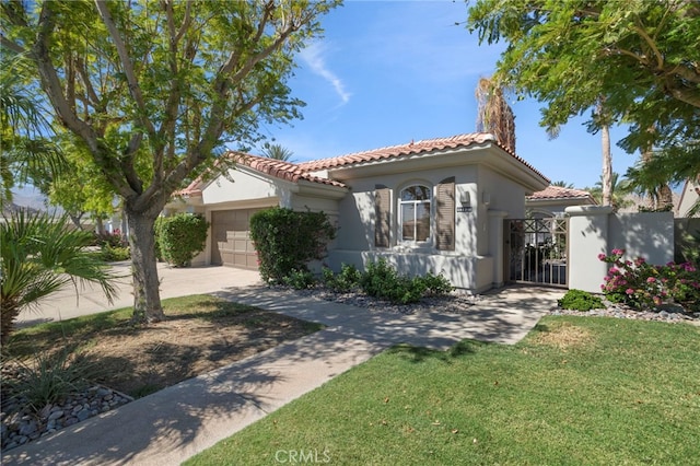 mediterranean / spanish house with a garage