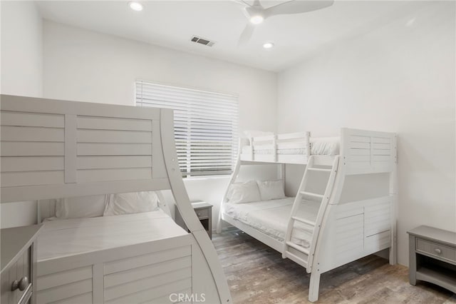 bedroom featuring wood-type flooring and ceiling fan