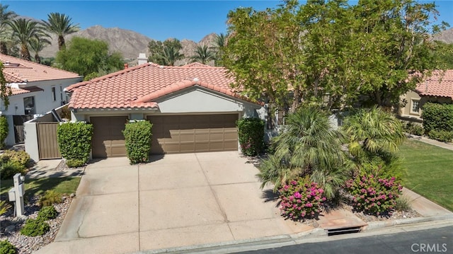 view of front of home featuring a mountain view and a garage