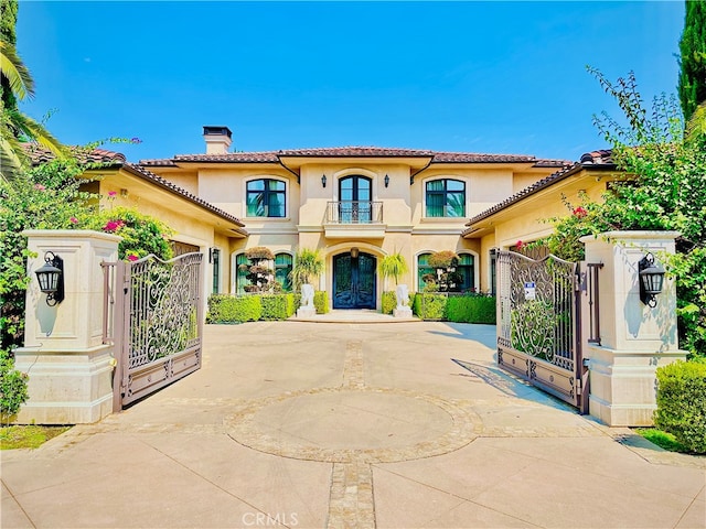 mediterranean / spanish-style house with a balcony